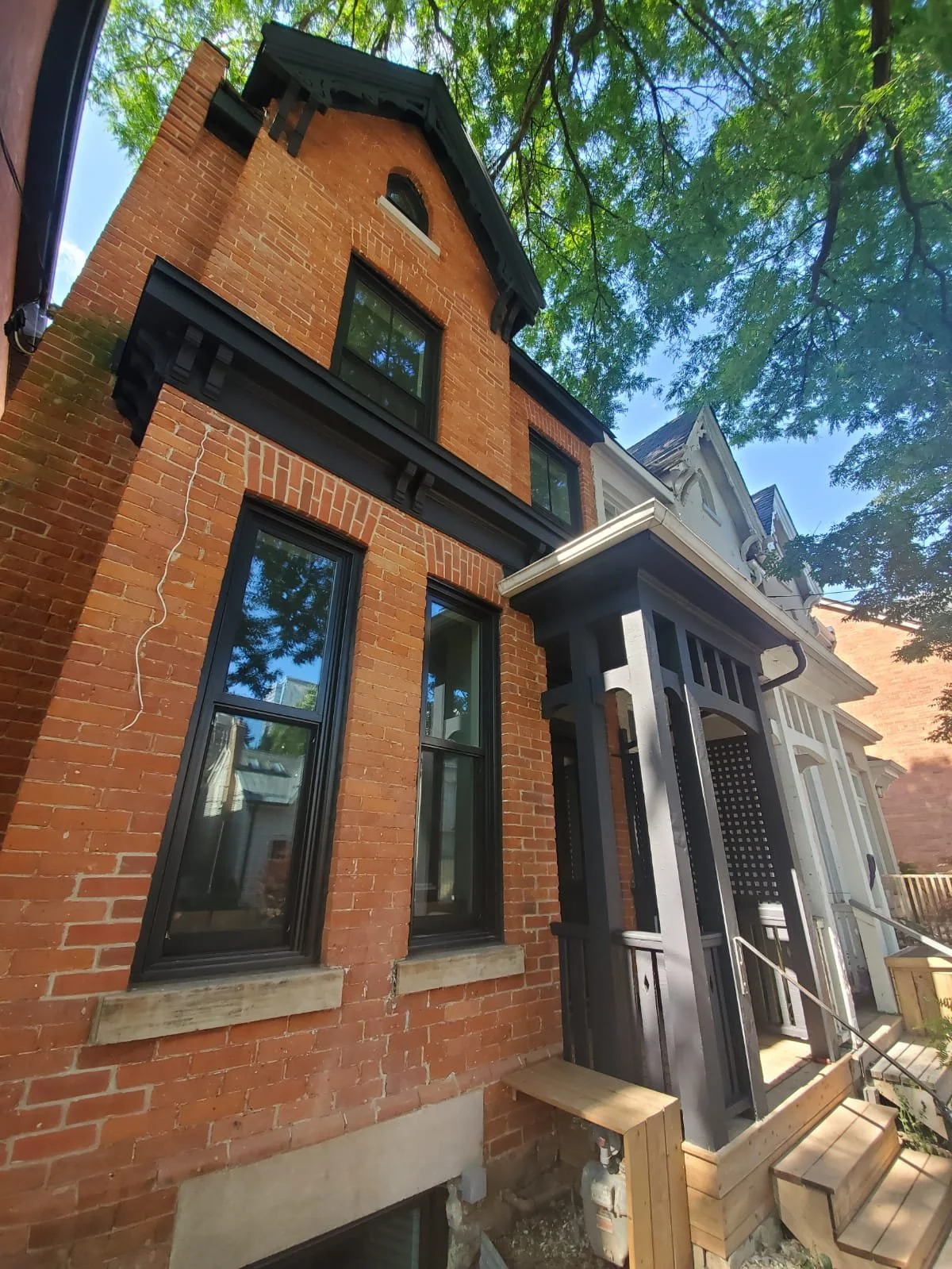 Exterior house painting — fresh white finish